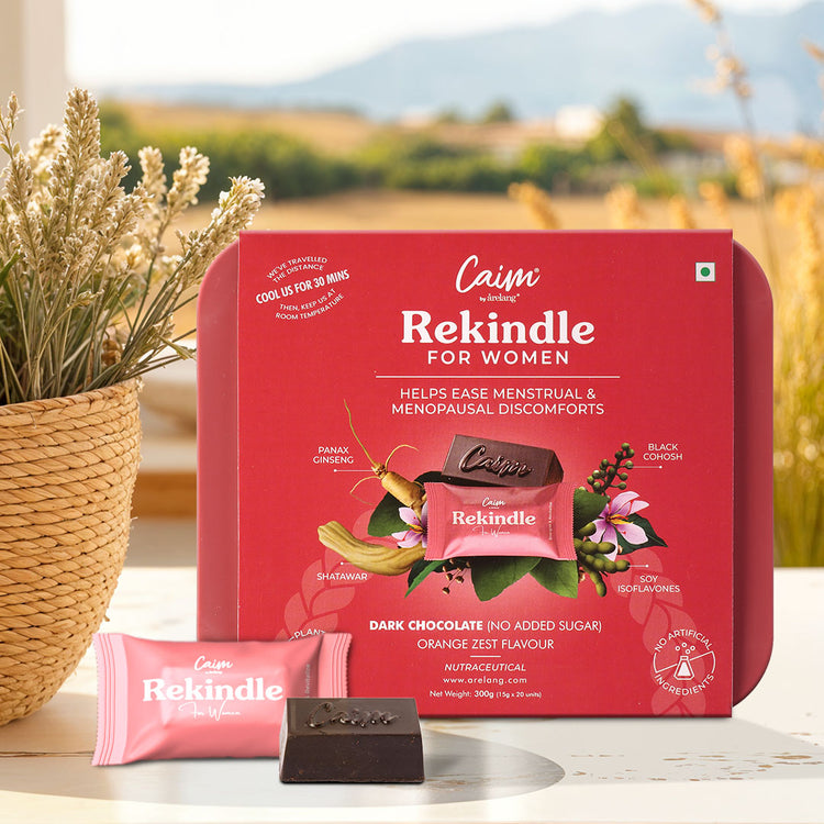 Red box of Caim Rekindle for Women on a table, promoting ease of menstrual and menopausal discomforts