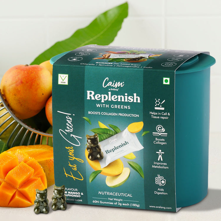 A box of Replenish with Greens gummies, surrounded by images of mangoes and leaves, indicating the product's natural ingredients and health benefits.
