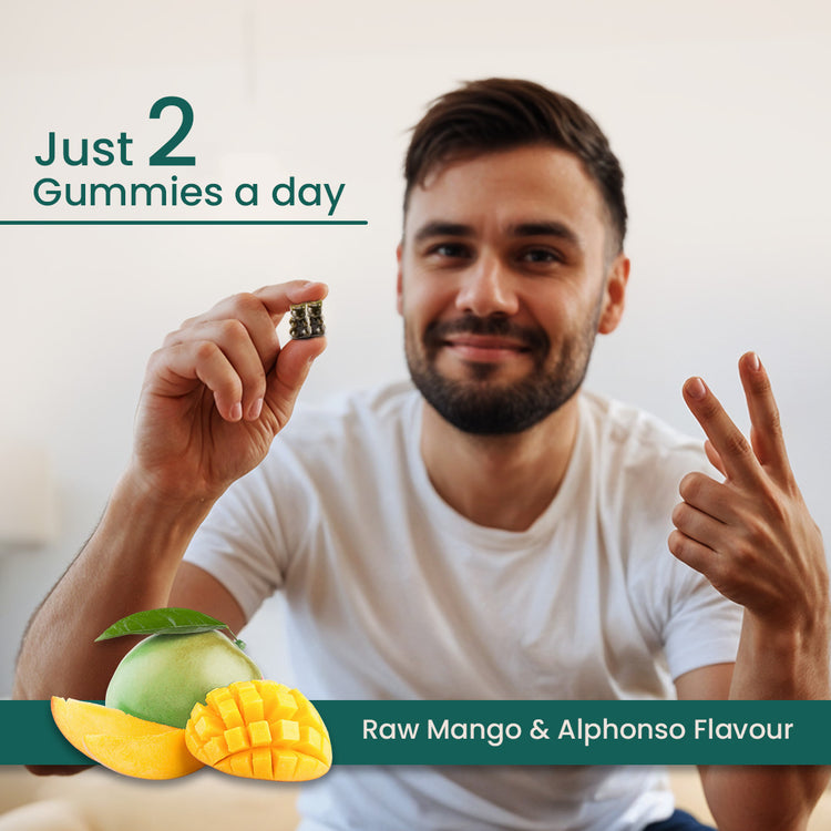 Man holding a gummy vitamin with raw mango and alphonso flavor text.